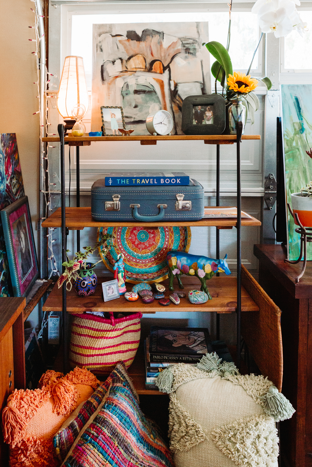 A lifestyle portrait photography session of a Santa Barbara artist Wendy Fisher in her creative studio. Images feature environmental portraiture and headshots focused on her paintings and creative work in progress.