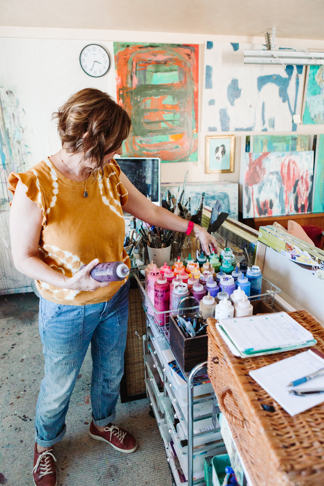 A lifestyle portrait photography session of a Santa Barbara artist Wendy Fisher in her creative studio. Images feature environmental portraiture and headshots focused on her paintings and creative work in progress.
