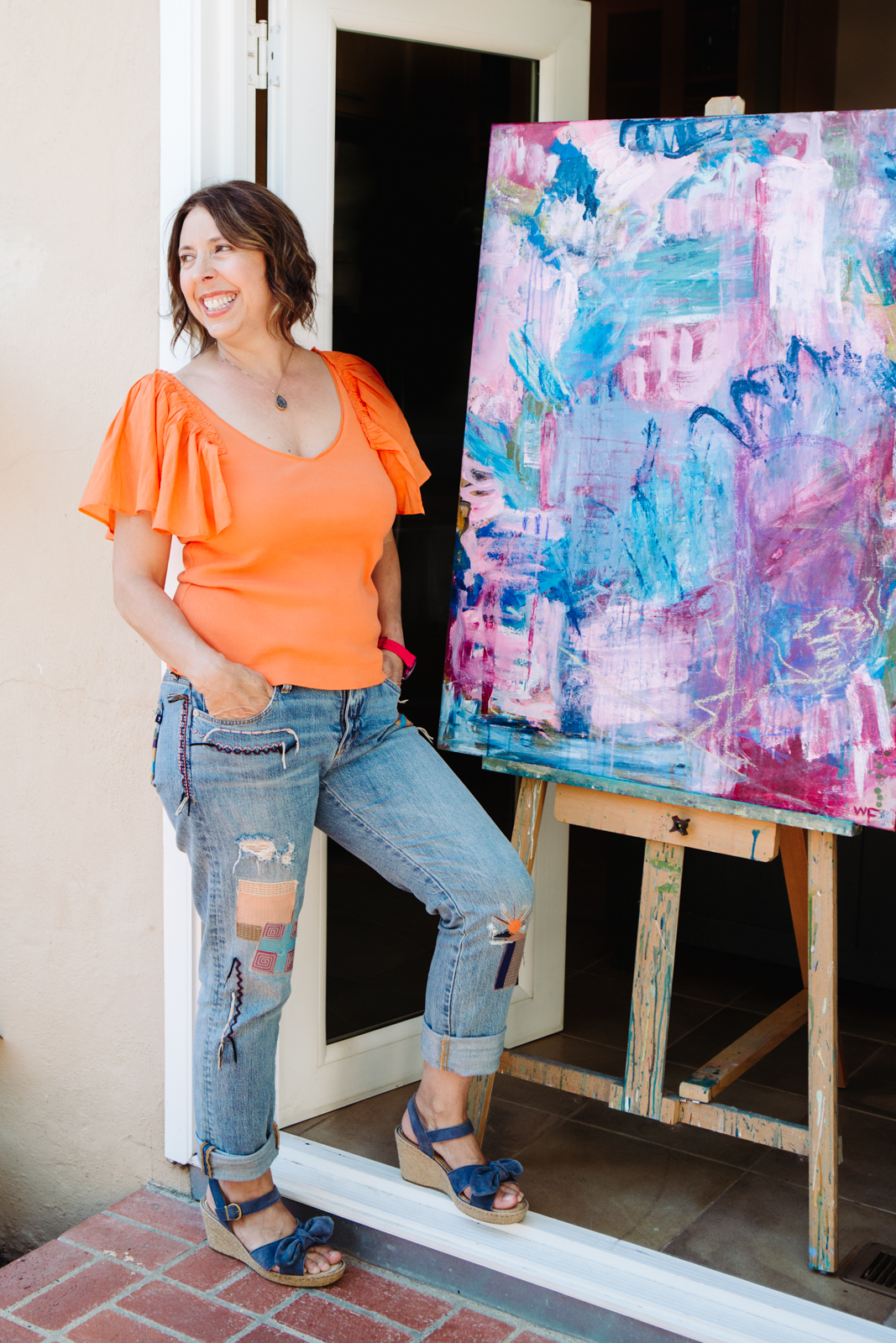 A lifestyle portrait photography session of a Santa Barbara artist Wendy Fisher in her creative studio. Images feature environmental portraiture and headshots focused on her paintings and creative work in progress.