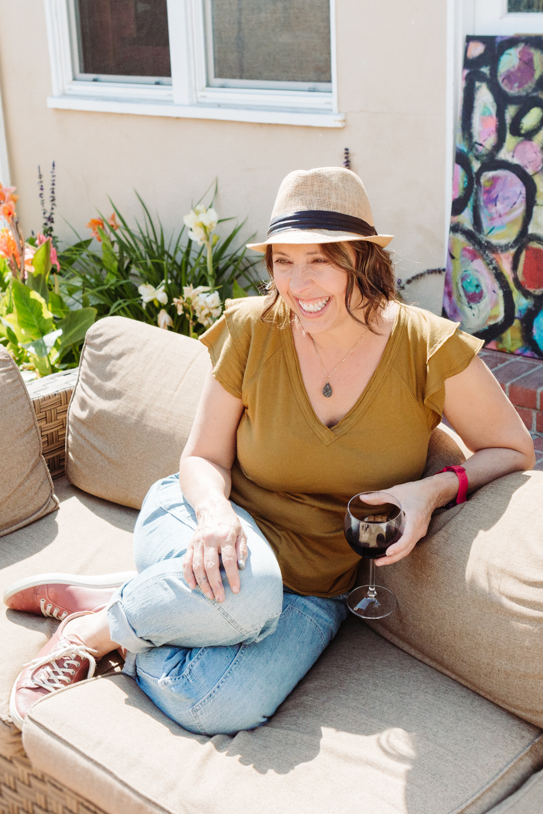 A lifestyle portrait photography session of a Santa Barbara artist Wendy Fisher in her creative studio. Images feature environmental portraiture and headshots focused on her paintings and creative work in progress.