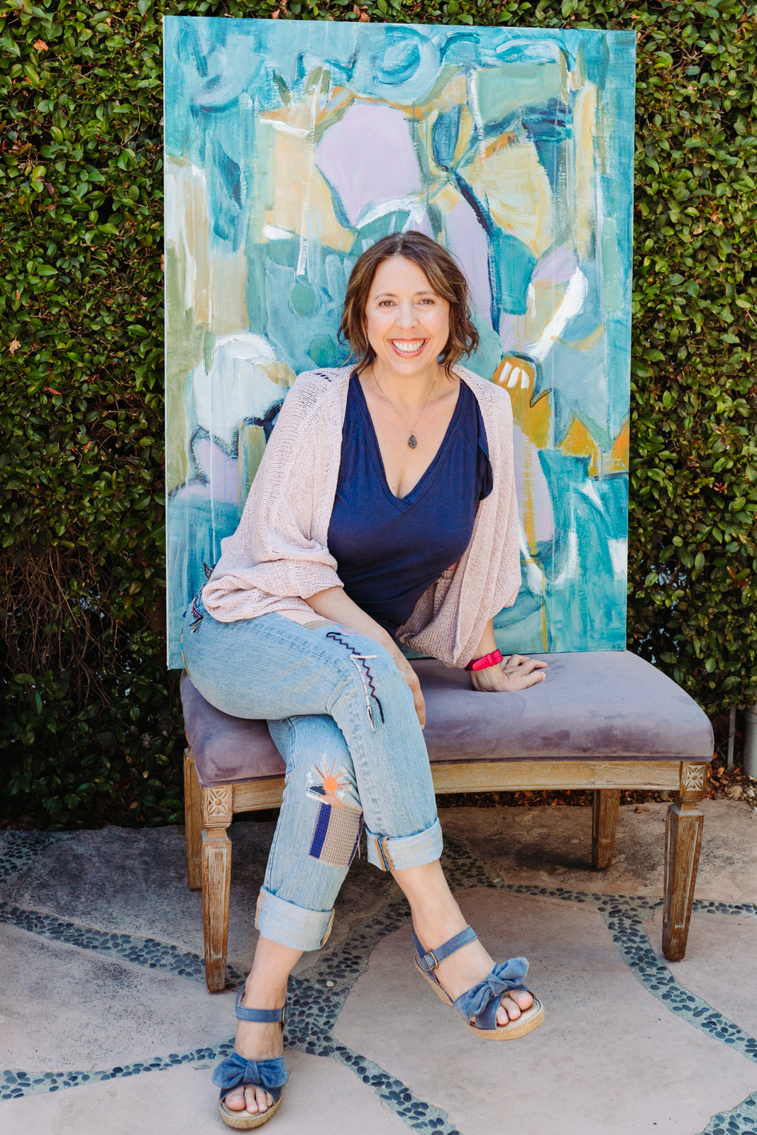 A lifestyle portrait photography session of a Santa Barbara artist Wendy Fisher in her creative studio. Images feature environmental portraiture and headshots focused on her paintings and creative work in progress.