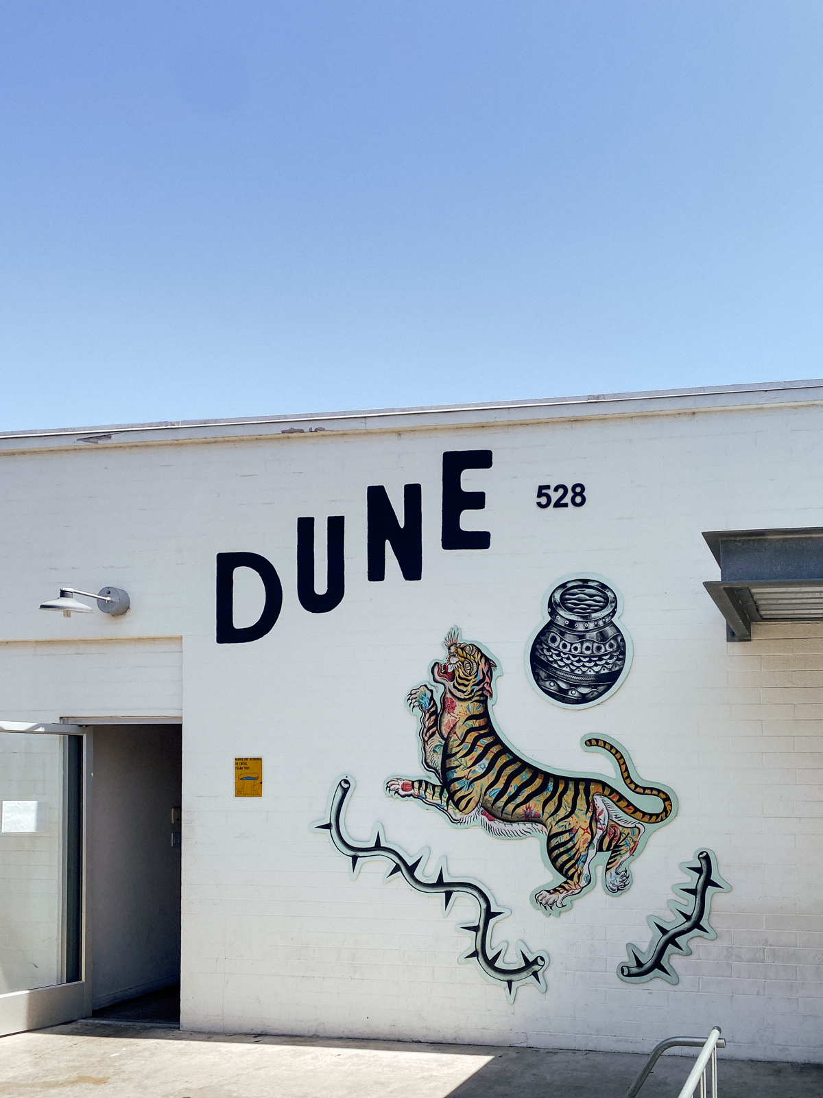 Mural by Michael Matheson (@metalteepee) at Dune Coffee in Santa Barbara California